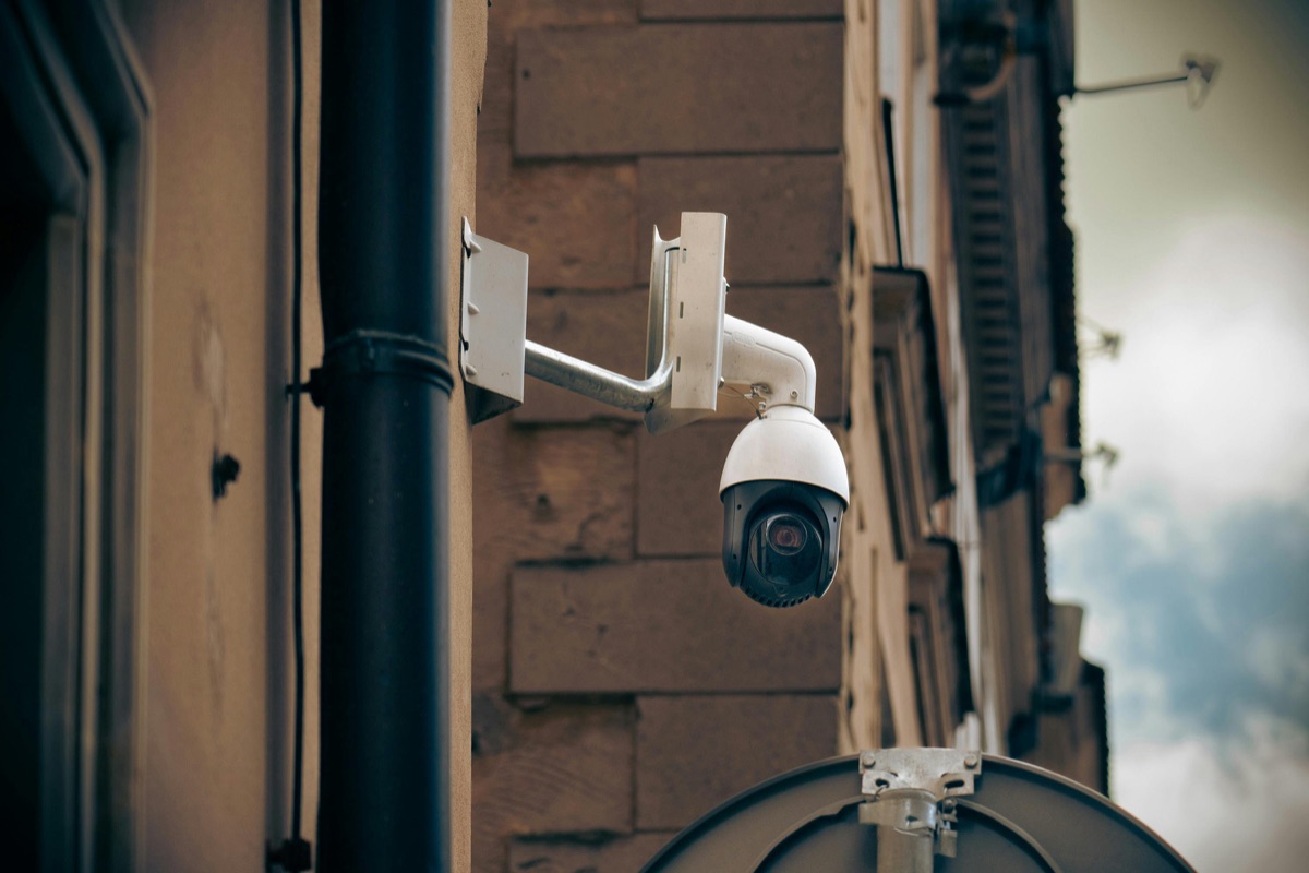PTZ video surveillance camera mounted on building exterior